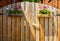 House wooden gates with hanging flower pots