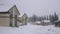 House in the woods in the mountains at winter weather. Nature in winter. Landscape panorama. Sheregesh, Siberia.