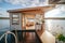 A houseboat with a bathroom on the deck. AI generative image. Tiny house, houseboat.