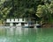 Houseboat crusing through the lake with mountain view at Kenyir Lake.