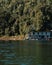 Houseboat crusing through the lake with mountain view at Kenyir Lake. Tasik Kenyir is a man made lake