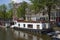 Houseboat with flowers on the canal at the Korte Prinsengracht