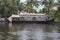 Houseboat moored on the bank of a canal