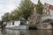 Houseboat moored at the side of an urban canal quayside