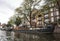 Houseboat moored at the side of an urban canal quayside