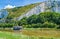 Houseboat moored by the white cliff