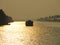 A houseboat sailing during sunset at Alleppy Backwaters, Kerala, India