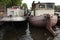 Houseboats moored on the Amstel River in Amsterdam, Netherlands.