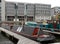 Houseboats moored on the jetty at leeds dock with surrounding apartment buildings