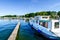 Houseboats and yachts are moored in Goehren-Lebbin Germany at a jetty of the lake Fleesensee