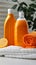 Household freshness Orange liquid washing powder bottle beside neatly folded towels