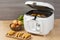 Household kitchen - A white automatic electric fryer pot