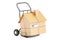 Household moving services concept. Hand truck with cardboard house