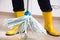 Housekeeper cleaning floor with flying mop