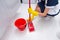 Housekeeper fitting a clean cloth to a mop