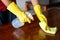 The housekeepers  used cloth and cleaning solution to clean the table and chair