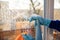 Housekeeping: cleaning the windows, Window cleaner using a squeegee, sponge and soap suds to wash a window