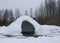 Housem eskimos igloo or yurt made by children from snow in a thaw in winter day