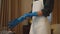 Housemaid put on protective gloves in hotel room