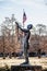 The Houser Peace statue of Native American man with a peace pipe stands at the entrance to the