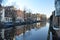 houses in amsterdam in spring on a sunny day view from the bridge