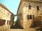 Houses with an arch in the medieval village of Rochemaure, France. Vintage effect