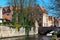 Houses, boat and canal in Bruges, Belgium