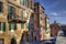 Houses and church in a street in Siena, Italy