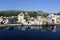 Houses and churches reflected in the blue waters