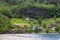 Houses by the coast of the lake in the Narrow Fjord in Aurland in Vestland county, Norway