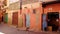 Houses with colored walls, door, gates, work shop in Marrakesh, Morocco, North Africa