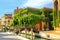 Houses covered with ivy along narrow canal with bridges in Venice, Italy.