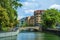 Houses on the embankment, bridge. City landscape with a river and houses.