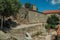 Houses made of stone and flowered garden