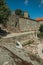 Houses made of stone and flowered garden