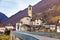 Houses and parish church in Alpine hamlet of Lavertezzo in winter, Switzerland