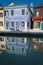 Houses and reflections in a canal, Burano, Italy