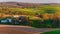 Houses, roads, farm fields and rolling hills of Southern York County, PA