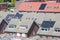 Houses with solar panels on roofs from aerial view in The Netherlands. Green energy.