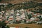 Houses and streets in a suburban neighborhood among fields