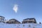 Houses surrounded by sweeping views of snow covered Wasatch Mountain landscape