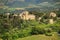 Houses surrounded by trees and fields in Val d`Orcia, Tuscany, I