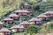 Houses and tea lantation on a hillside in the Kuomintang Chinese village of Mae Aw or Baan Rak Thai, Mae Hong Son, Thailand