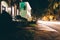 Houses and traffic at night on Drayton Street in Savannah, Georgia.