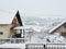 Houses and trees and fences under white snow - village Milanovac at winter, Croatia