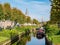 Houses with waterside gardens on Eegracht canal in IJlst, Friesland, Netherlands