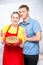 housewife in apron with a pie and her beloved husband