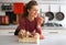 Housewife with basket with mushrooms in kitchen