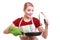 Housewife chef in kitchen apron with frying pan