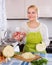 Housewife chopping cabbage for soup